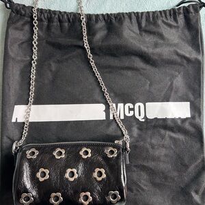 Alexander McQueen Black Eyelet-Embellished Textured Patent-Leather
Shoulder Bag